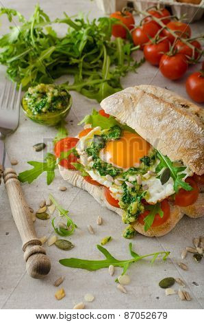 Ciabatta With Fried Egg, Tomatoes And Pesto