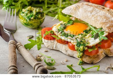 Ciabatta With Fried Egg, Tomatoes And Pesto