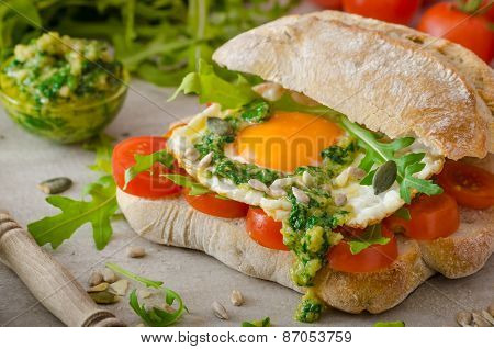 Ciabatta With Fried Egg, Tomatoes And Pesto