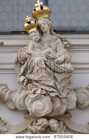 GRAZ, AUSTRIA - JANUARY 10, 2015: Virgin Mary with baby Jesus on the portal of Mariahilf church in Graz, Styria, Austria on January 10, 2015.