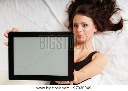 Sexy Lazy Girl Lying With Tablet Touchpad On Bed