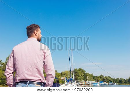 Nice man standing turned backwards