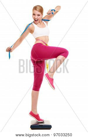 Happy Woman Measuring On Weighing Scale. Weight.