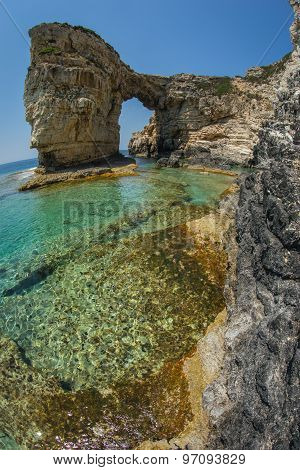 Unique And Scenic Arch In The Cliffs, Paxi, Greece