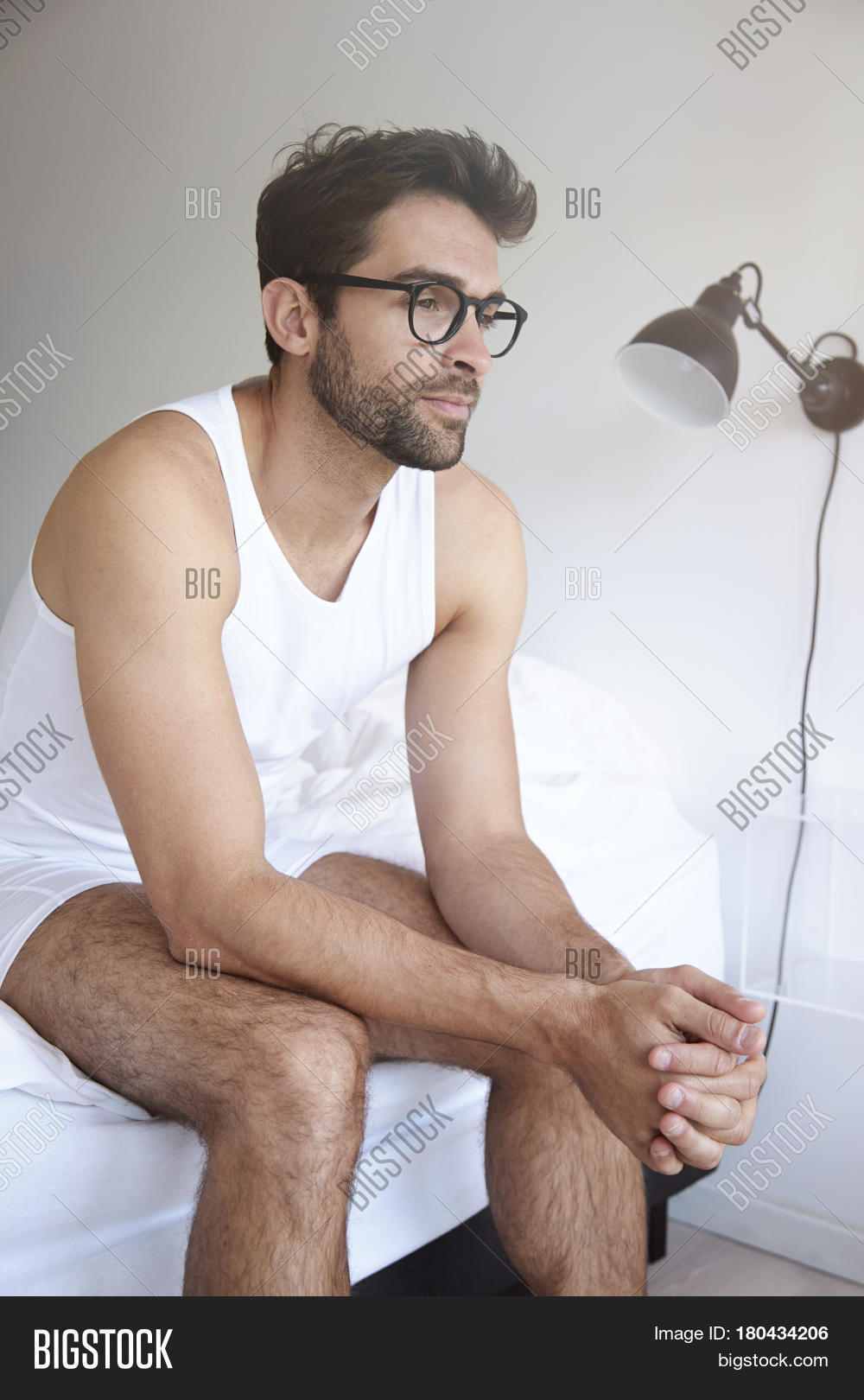 Man Sitting On Edge Bed Looking Image & Photo Bigstock