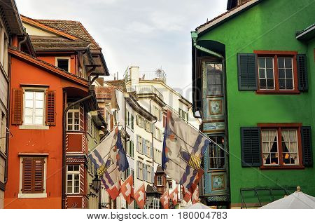 Flags On Augustinergasse Pedestrian Street In Zurich Center