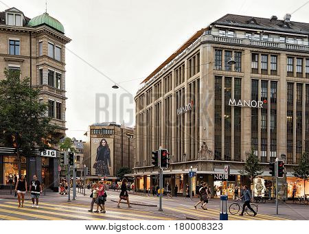 Cars And Pedestrians On Bahnhofstrasse At Zurich City Center