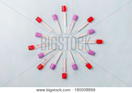 Test tubes for laboratory diagnosis blood tests on a blue background.