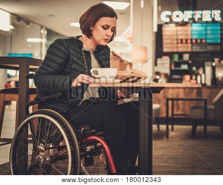 Physically challenged women in a cafe