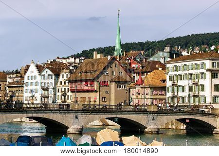 Limmat River and spire of Predigerkirche in the city center of Zurich Switzerland.