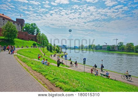 People And Wawel At Embankment Of Visla River Krakow