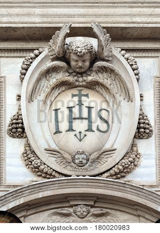 ROME, ITALY - SEPTEMBER 01: Christogram IHS, facade of the Church of the Gesu, mother church of the Society of Jesus, Rome, Italy on September 01, 2016.