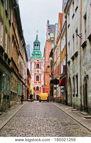 Cobblestone Street And St Stanislaus Church In Old Town Poznan