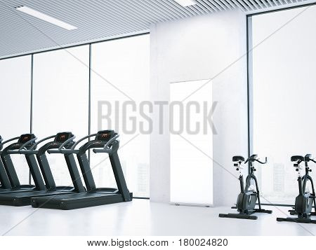 Treadmills, bicycle simulators and blank roll-up bunner in bright interior. 3d rendering