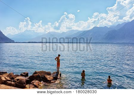 People Swimming In Geneva Lake In Montreux