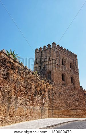 Ancient City Walls And Tower In Macarena District Seville