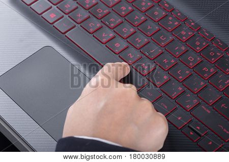 Finger Pushing Space Bar Button On Laptop Keyboard