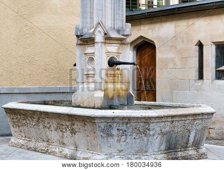 Fountain At Helferei On Zwingliplatz Square In Zurich