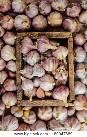 Close-up Garlic Bulbs And Garlic Cloves On Wodeen Background. Ga