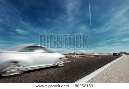 Highway speed auto trafic motion with sky background