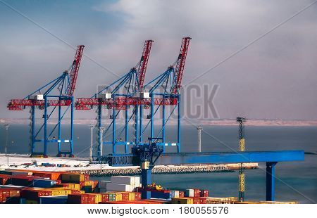 Logistics and transportation of Container Cargo ship with working crane bridge in seaport.hd