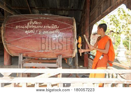 Buddhist Monk Playing Big Drum At Champasak On Laos