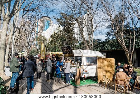Madrid Spain - Januaty 22 2017: People eating and drinking in MadrEat a street fod event in Azca downtown district.