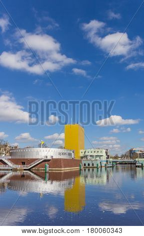 GRONINGEN, NETHERLANDS - APRIL 03, 2017: Museum of Groningen with reflection in the water in The Netherlands