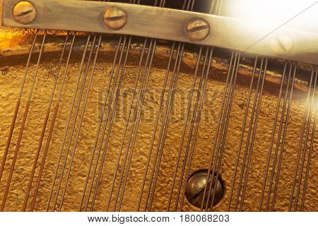 The internal components of the old piano strings and soundboard