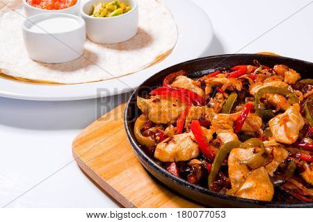 Stir Fry Chicken With Sweet Peppers And Green Beans In Wok Pan
