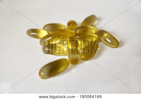 Handful of evening primrose oil supplement capsules