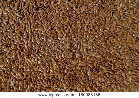 Lots of brown flax seed from above (background)