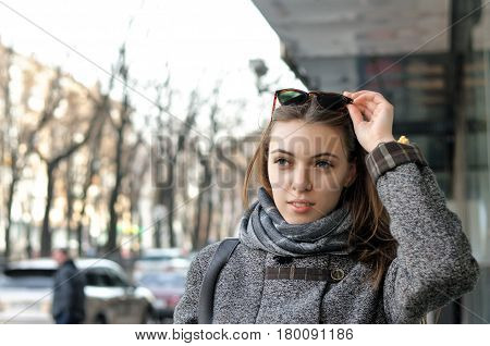 Вeautiful Woman Is Walking Down The Street In The City