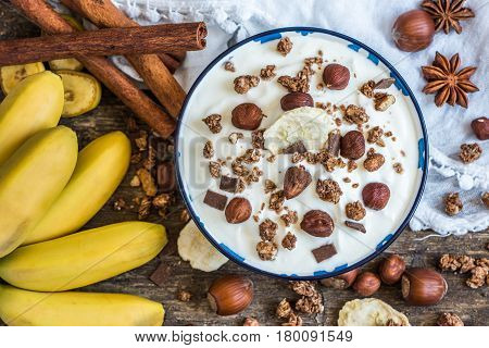 Serving of White Yogurt with Muesli Banana and Nuts