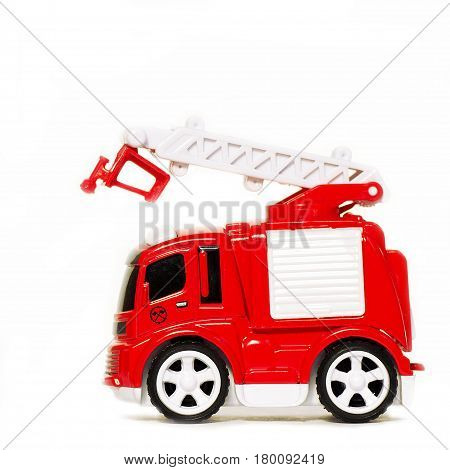 car toy red fire truck with extendable ladder and basket, copy space