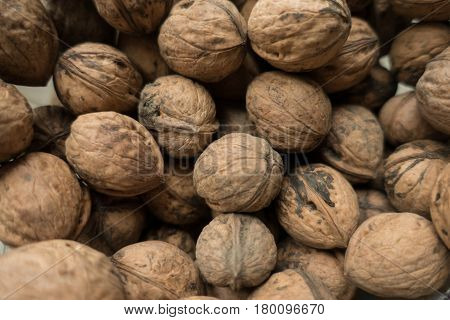 Whole unpeeled dry organic walnuts from above