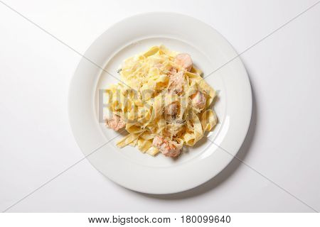 Pasta Fettuccine Alfredo With Chicken, Parmesan And Parsley On White Plate. Italian Cuisine.