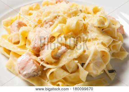 Pasta Fettuccine Alfredo With Chicken, Parmesan And Parsley On White Plate. Italian Cuisine.