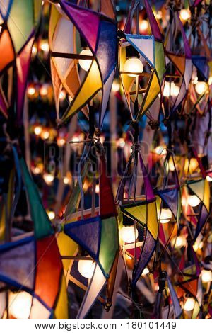 Multi colored star lamps and background .