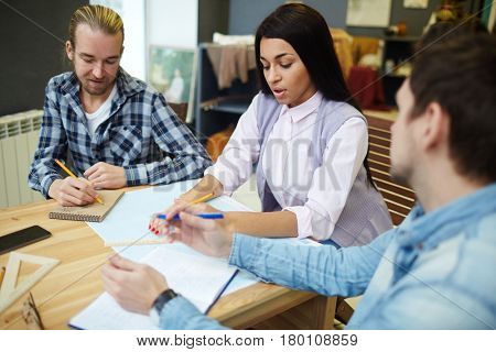 Young people concentating on work at meeting