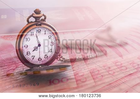 pocket watch over yuan banknotes with double exposure effect time is money business and finance concept