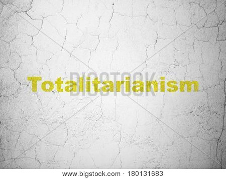 Politics concept: Yellow Totalitarianism on textured concrete wall background