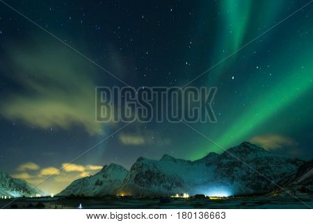 Aurora Borealis Known as Nother Lights Playing with Vivid Colors Over Lofoten Islands in Norway. Horizontal Image Orientation