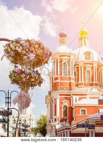 The church of Saint Clement of Rome in Moscow with flowers on the foreground.
