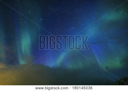 Aurora Borealis Known as Nother Lights Playing with Vivid Colors Over Lofoten Islands in Norway. Horizontal Image Orientation