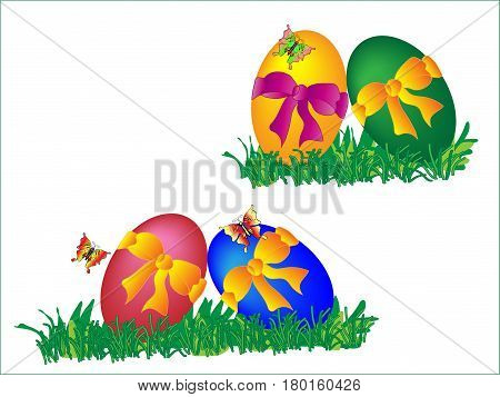 Colored four easter eggs with bows in the grass