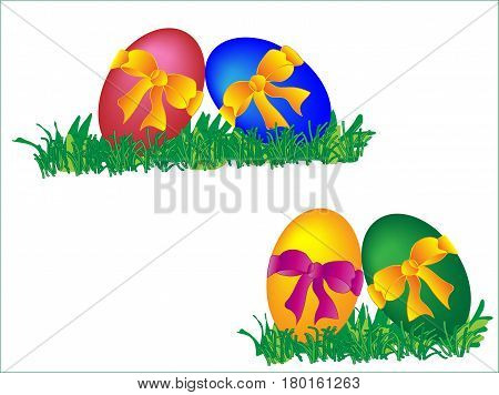 Colored four easter eggs with bows in the grass