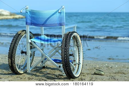 Wheelchair By The Sea In Summer With Large Wheels