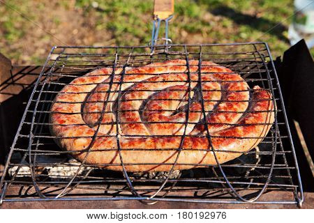 Pork Wurst Grilled On A Coals. Sausages Barbecue.
