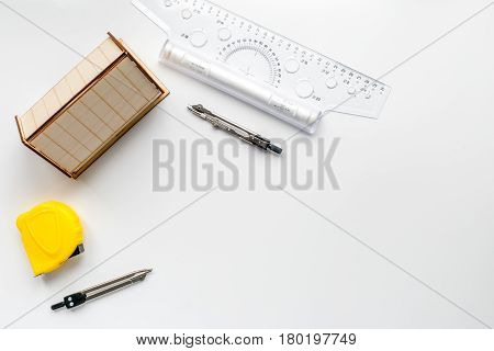 Architects workplace with constructor tools with miniature on white table background top view mock up